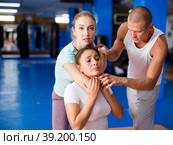 Woman doing chokehold movement. Стоковое фото, фотограф Яков Филимонов / Фотобанк Лори