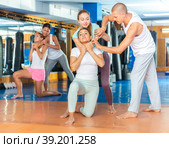 Woman doing chokehold movement. Стоковое фото, фотограф Яков Филимонов / Фотобанк Лори