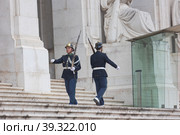 Lisbon, Portugal, 22 december 2022: Guard of Honor near Assembly of the Republic -men patrolling the entrance to the building. Редакционное фото, фотограф Константин Шишкин / Фотобанк Лори