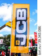 Dealership flag JCB at the annual Volga agro-industrial exhibition (2022 год). Редакционное фото, фотограф FotograFF / Фотобанк Лори