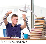 Young student forced to study tied. Стоковое фото, фотограф Elnur / Фотобанк Лори