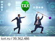 Businessman in tax balloon concept. Стоковое фото, фотограф Elnur / Фотобанк Лори