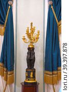 Gavrila Derzhavin Estate Museum in St. Petersburg, Russia. Graceful gold-plated candlestick (2023 год). Редакционное фото, фотограф Валерия Попова / Фотобанк Лори