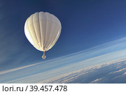 Chinese balloon flying high in the sky above the stratosphere, which violated the US air border. Стоковое AI-изображение, AI-художник Владимир Разгуляев / Фотобанк Лори