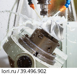 CNC milling machine processing impeller. Coolant in metalwork industry. Стоковое фото, фотограф Дмитрий Калиновский / Фотобанк Лори