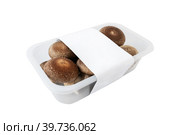shiitake organic mushrooms for sale in a plastic tray on a light background. lentinula edible, Japanese forest mushroom. Стоковое фото, фотограф Оксана Медведева / Фотобанк Лори