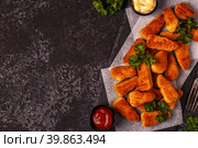 Chicken naggets with sauces on dark background. Стоковое фото, фотограф Татьяна  Бральнина / Фотобанк Лори