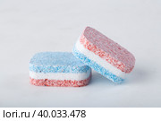 Dishwasher tablets on a white background. The use of powder for washing dishes. Стоковое фото, фотограф Александр Поташев / Фотобанк Лори