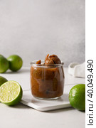 Popular Sri Lankan lime pickle with salt, chilli, pepper. Vertical format. Стоковое фото, фотограф Светлана Лажко / Фотобанк Лори