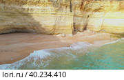 Flying Above Atlantic Ocean Bay Toward Sandy Wild Beach Under Cliff. Aerial View. Стоковое видео, видеограф Кирилл Трифонов / Фотобанк Лори