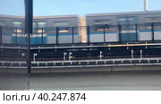 The Moscow metro train passes through the metro bridge between the administrative buildings. Sokolniki district Moscow.28.03.2023. Редакционное видео, видеограф Ярославский Максим / Фотобанк Лори