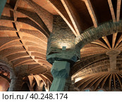 SANTA COLOMA DE CERVELLO, SPAIN - DECEMBER 30, 2022: Inticate geometric shapes of stucture of roof of Colonia Guell. Редакционное фото, фотограф Яков Филимонов / Фотобанк Лори