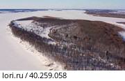 Западная Сибирь: река Обь зимой. Вид с воздуха. Western Siberia: the Ob River in winter. Aerial view. Стоковое видео, видеограф Евгений Романов / Фотобанк Лори