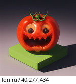 This macabre tomato has a pumpkin-like appearance with eyes and teeth that are frightening. AI generated. Стоковое AI-изображение, AI-художник Сергей Старуш / Фотобанк Лори