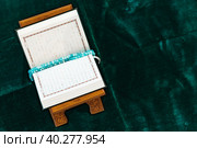 Holy Quran with prayer rosary beads on wooden stand. Стоковое фото, фотограф Сергей Толмачёв / Фотобанк Лори