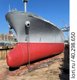 Dry-cargo ship in dry dock for repairs and maintenance at a shipyard. Стоковое фото, фотограф Ирина Старикова / Фотобанк Лори