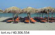 Video of Elafonisi Beach with sunbeds and umbrellas made from woven palm leaf. Crete, Greece. Стоковое видео, видеограф Сергей Пристяжнюк (Serg Zastavkin) / Фотобанк Лори