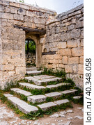Stone steps and wall famous ancient city-fortress Chufut-Kale ("Jewish Fortress" in Turkish) built in 5th - 6th century in the Crimean Mountains (2019 год). Стоковое фото, фотограф Сергей Фролов / Фотобанк Лори