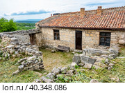Estate of Abraham Firkovich (Karaite writer and archeologist) built in 18th century in the famous ancient city-fortress Chufut-Kale ("Jewish Fortress" in Turkish) in the Crimean Mountains (2019 год). Стоковое фото, фотограф Сергей Фролов / Фотобанк Лори