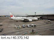 Tokyo, Japan - 10 Nov 2013: The airplane of Japan Airlines in the airport, Tokio, Japan. Редакционное фото, фотограф Сергей Стрелков / Фотобанк Лори