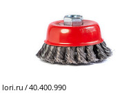 Metal cup brush for cleaning surfaces from rust and paint on a white background. The metal brush for the grinding machine is a cup made of twisted wire. Стоковое фото, фотограф Александр Кротков / Фотобанк Лори