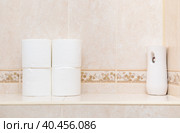 Rolls of white toilet paper and air freshener on the toilet shelf. Стоковое фото, фотограф Юрий Поздников / Фотобанк Лори