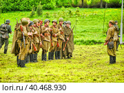 Soldiers in military uniform of the second world war at the historical reconstruction to the Day of the Border Guard. Стоковое фото, фотограф Анна Кривицкая / Фотобанк Лори