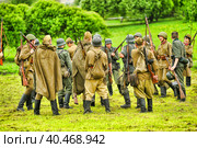 Soldiers in military uniform of the second world war at the historical reconstruction to the Day of the Border Guard. Стоковое фото, фотограф Анна Кривицкая / Фотобанк Лори