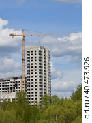 Moscow, Russia - 4 May.2023. Liebherr cranes build residential buildings in Zelenograd. Редакционное фото, фотограф Володина Ольга / Фотобанк Лори