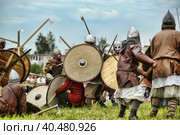 Russia, Staraya Ladoga 23,06,2012 Reenactors with shields and spears during the battle, the festival of historical reconstruction "Pages of History" Стоковое фото, фотограф Анна Кривицкая / Фотобанк Лори