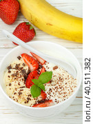 Traditional healthy Breakfast. Natural yogurt with strawberries, banana and chocolate. Selective focus. Стоковое фото, фотограф Виктория Панченко / Фотобанк Лори