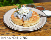 Plate of Belgium waffles with dragon fruit and ice cream on wooden table. Стоковое фото, фотограф Татьяна Терехина / Фотобанк Лори