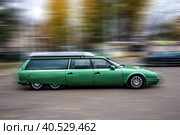 Green vintage six-wheeled car, blurred background. Стоковое фото, фотограф Iva Noel / Фотобанк Лори