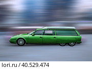 Green vintage six-wheeled car, blurred background. Стоковое фото, фотограф Iva Noel / Фотобанк Лори