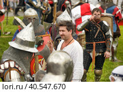 Knights in military uniforms at the Festival of the historical reconstruction of the Middle Ages "Vyborg Castle" (2014 год). Редакционное фото, фотограф Анна Кривицкая / Фотобанк Лори