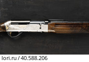 Smoothbore hunting gun on black background close up. Стоковое фото, фотограф Сергей Толмачёв / Фотобанк Лори