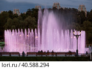 Light and music fountain on a summer evening. Natural Museum-reserve "Tsaritsyno". Colorful fountain in Tsaritsyno Park at night. (2023 год). Редакционное фото, фотограф Photojuli / Фотобанк Лори