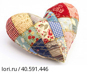 Multicolored pillow made of heart-shaped patches. Created by AI. Стоковое AI-изображение, AI-художник Ярославский Максим / Фотобанк Лори