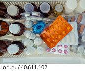 Medical background with various medicines. Bottles of tinctures and antiseptics, blister tablets and other medicines on the shelf. View from above. Стоковое фото, фотограф Бузмакова Светлана / Фотобанк Лори