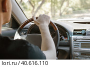 A man driving a car, rear view from the passenger compartment. Safe driving. Стоковое фото, фотограф Коханова Наталья / Фотобанк Лори