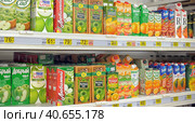 Russia, St. Petersburg 03,04,2014 Juices in packs on the supermarket shelf. Редакционное фото, фотограф Анна Кривицкая / Фотобанк Лори