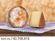 whole head of ripe country cheese and slices on hay. Стоковое фото, фотограф Татьяна Яцевич / Фотобанк Лори