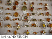 Estonia, Tallinn, 10,10,2014 Rings with amber for sale. Редакционное фото, фотограф Анна Кривицкая / Фотобанк Лори