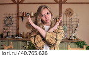 Close-up female portrait young caucasian woman showing prohibition sign crossing arms making refusal gesture negative shaking head dissatisfied serious girl says no refuses demonstrates stop. Стоковое видео, видеограф Сахарова Мария Юрьевна / Фотобанк Лори