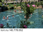Pammukale, Turkey - July, 19, 2015: People in antique Cleopatra's pool with thermal water in ancient city Hierapolis, near modern Turkey city Denizli. Редакционное фото, фотограф Анна Кривицкая / Фотобанк Лори