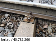 Railways. Metal steel rails and wooden sleepers. Rivets and fasteners on the railroad. Stony backfill of railway tracks. Station Nyrki, Karelia. Стоковое фото, фотограф Юлия Петровская / Фотобанк Лори