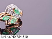 Gold earrings with green emeralds. Стоковое фото, фотограф Сергей Сергеев / Фотобанк Лори