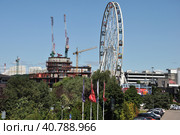 Krasnogorsk, Russia - July 22. 2021. View of Shopping center Vegas Crocus City and ferris wheel. Редакционное фото, фотограф Володина Ольга / Фотобанк Лори