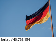 German national flag on blue sky background (2016 год). Стоковое фото, фотограф Igor Tichonow / Фотобанк Лори
