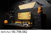 A general view of a gamer's home workplace with a computer and a gamepad decorated with decorations for the Halloween holiday. Стоковая иллюстрация, иллюстратор Енваев Андрей / Фотобанк Лори